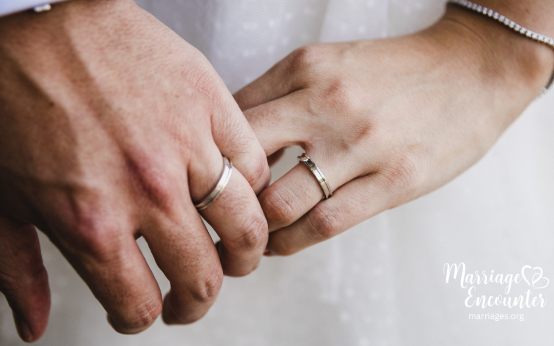 A close up of a married couple holding hands, symbolizing hope, faith, and unity while walking through life’s challenges together.